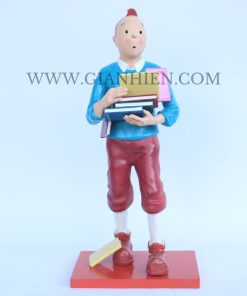 Tintin statue of boy holding book
