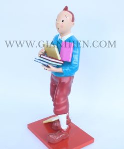 Tintin statue of boy holding book