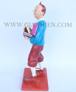 Tintin statue of boy holding book